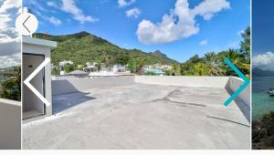 a picture of a house with a view of the ocean at Maranatha Villa in La Gaulette