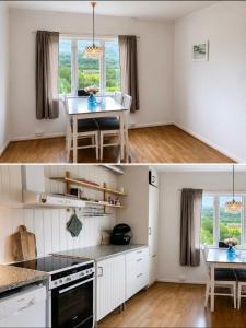 a kitchen and dining room with white cabinets and a table at Midtigården in Teksdal