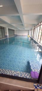 a large swimming pool in a building at Meteor Garden in Nairobi