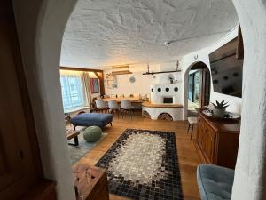 a living room with a couch and a table at Appartement Schönpflug in Kaprun