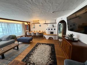 a living room with a couch and a table at Appartement Schönpflug in Kaprun