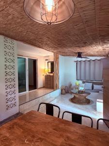 a dining room with a table and chairs in a room at Star Fish Cozy House in Ban Nua +16 photos