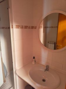 a bathroom with a sink and a mirror at La Bodega Del Camino in Lorca +55 photos