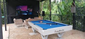 a pool table in front of a gazebo at Eco Boutique-Naranjo in La Vega