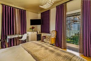 a hotel room with a bed and a window at Batavia Boutique Hotel in Stellenbosch +112 photos