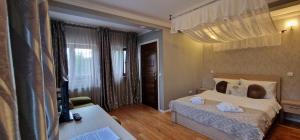 Vila Slănic family boutique hotel by Di'aDOR rentals 객실 침대 사진 68개 이상