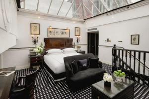 a hotel room with a bed and a chair at 41 in London