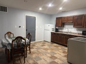 a kitchen with a table and a white refrigerator at Canton River House in Canton