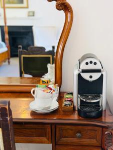 a coffee maker sitting on top of a table at Islay House in Bridgend