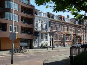 a building on a street with bikes parked in front of it at Hotel De Ruyter in Vlissingen