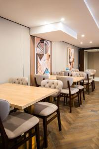 a row of tables and chairs in a waiting room at Ustyurt boutique hotel in Aktau