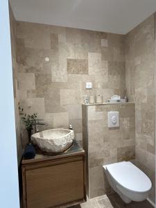 a bathroom with a sink and a toilet at Des Ciappes et des Fées in Menton +39 photos