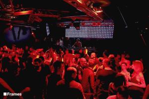 a crowd of people sitting in a theatre with red lights at Suite in Private Villa in Milan