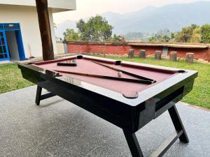 a pool table sitting on top of a sidewalk at Villa Kay Terrace in Campaka