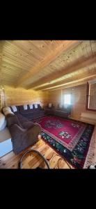 a room with a couch and a rug on the floor at Grand house in Rožaje