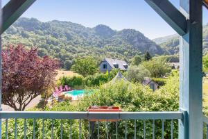 a view from the balcony of a house with a swimming pool at Gîte Viscos - L'escapade en famille l Ô Domaine de Geu in Geu +5 photos