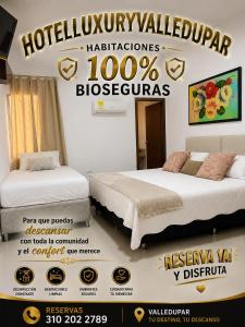 a poster for a hotel room with two beds at HOTEL LUXURY v in Valledupar