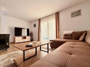 a living room with a couch and a flat screen tv at Kuća za odmor Bruna in Livno