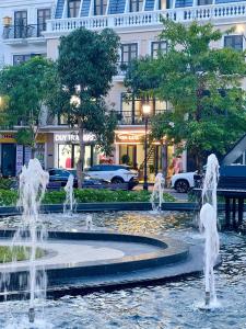 a fountain in the middle of a city at Vin Luxury Hotel in Quang Tri