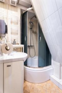 a bathroom with a shower and a sink and a toilet at Ski House Szczyrk - Solisko in Szczyrk +23 photos