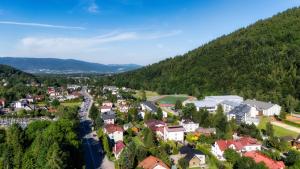 an aerial view of a small town in the mountains at Ski House Szczyrk - Centrum in Szczyrk