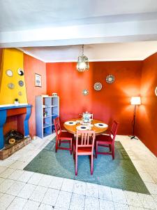 a dining room with a table and chairs at Wayra Glider Norma Centro in Norma
