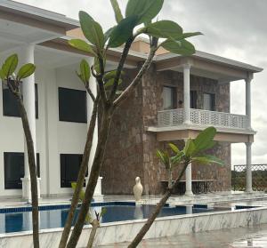 a house with a swimming pool in front of it at Hari Bagh Jawai in Bijāpur