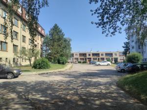 an empty parking lot in front of a building at Apartman AK Slatinany in Chrudim