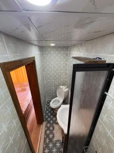 a bathroom with a toilet and a sink at Ayataç Konak Otel in Urfa +12 photos