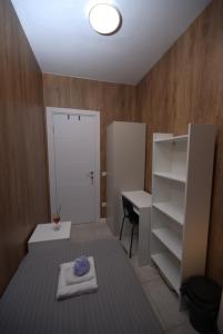 a room with a bed and a desk and a door at The Lemon House in Tel Aviv +28 photos