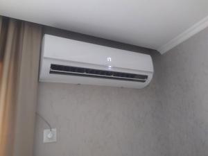 a bathroom with a air conditioner in a room at Alped in Zestafoni +2 photos