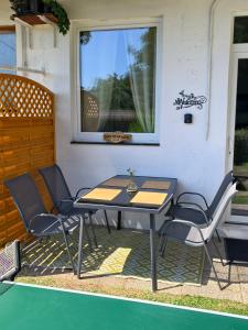 a table and chairs sitting on a patio at Ferienwohnung Kirchenbauer in Rieding