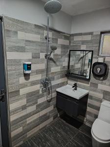 a bathroom with a shower and a sink and a toilet at Macchiato Homestay - Musslim Homestay in Klang +24 photos