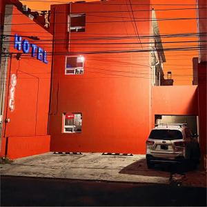 a car parked in front of a building at Access Blue Cristalh in Monterrey