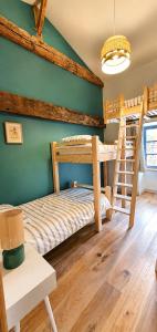 a bedroom with two bunk beds and a ladder at La borderie de Beauregard in Treize-Vents +31 photos