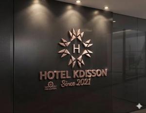 a hotel klostron sign on a glass wall at Hotel KDISSON in Mohaniā