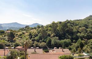 a view of a village with mountains in the background at The Rooftop Apartments in Basauri