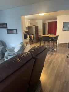 a living room with a couch and a table at Condo DidiPier in La Tuque +5 photos