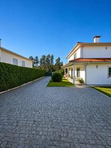 a driveway in front of a house at Casa Corujeira in Santa