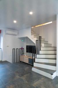 a living room with a staircase and a fireplace at Casa Loma Manolo in Molinaseca