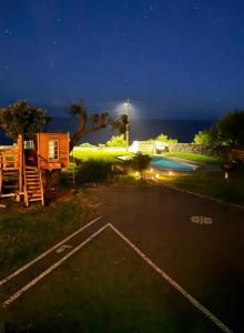 a view of a parking lot at night at Blue Whale Appartment in Horta