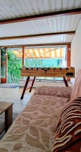 a pool table in a room with a bed at GADD Ferienwohnung 004 Glück an der Donau I Best Prestige Stay 24 h Check-In in Straubing