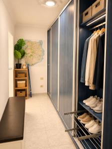 a walk in closet with a glass door at Roca Mogán in Puerto de Mogán