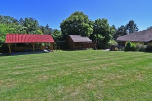 a large yard with a pavilion and a gazebo at Penzión Hôrka in Vinné +44 photos