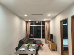 a living room with a couch and a table at Klcc vortex runner in Kuala Lumpur