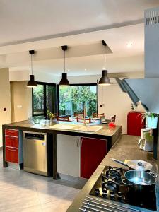 a kitchen with a stove and a counter top at Sunny Suites Madagascar in Antananarivo