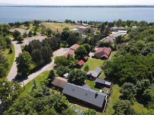 an aerial view of a house with the ocean in the background at Penzión Hôrka in Vinné
