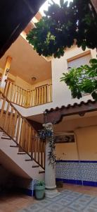 a staircase in a house with potted plants at Toledo Magico in Toledo