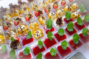 a tray of appetizers with fruit and other foods at Uroczysko Porszewice - Ośrodek Rekolekcyjno-Konferencyjny koło Łodzi in Łódź