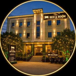 a building with a sign that reads bed and room at Hotel Bed & Room in Agra +10 photos